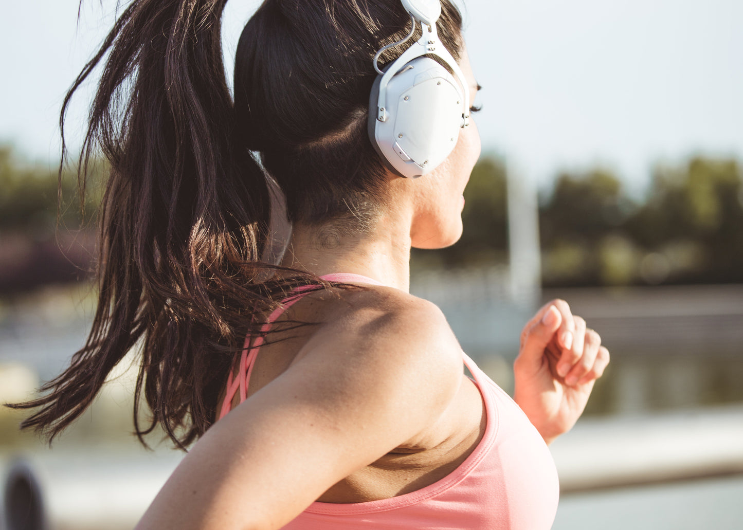 woman runs and listens to music