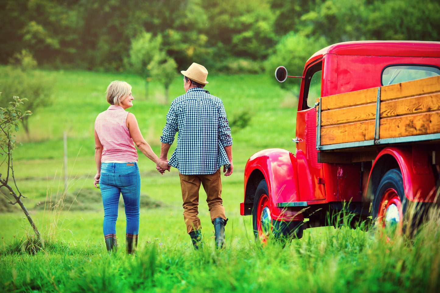 couple with truck on farm