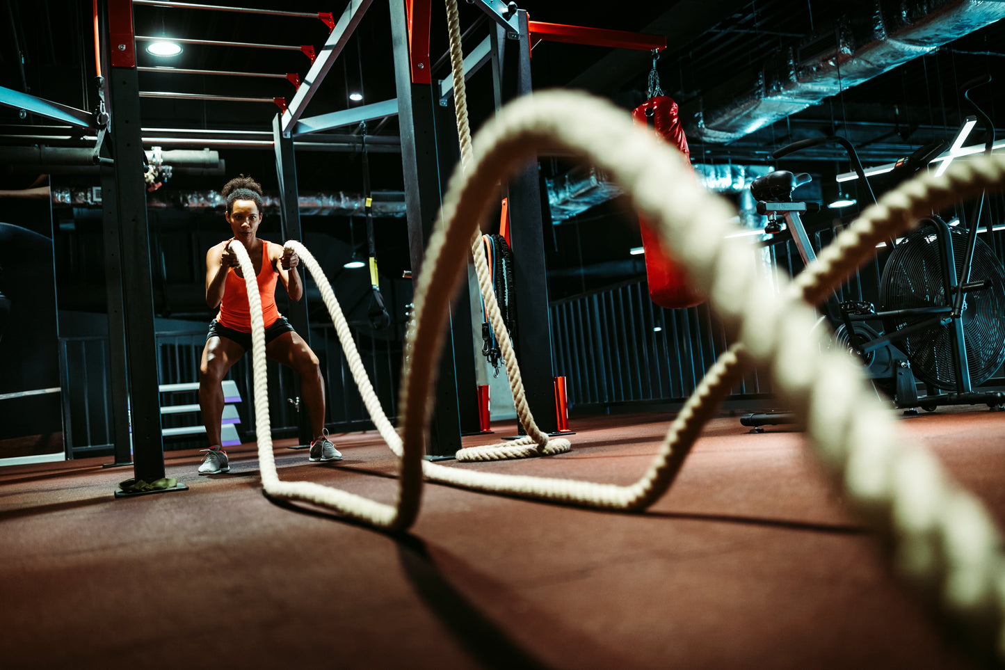 fitness woman cardio ropes in gym