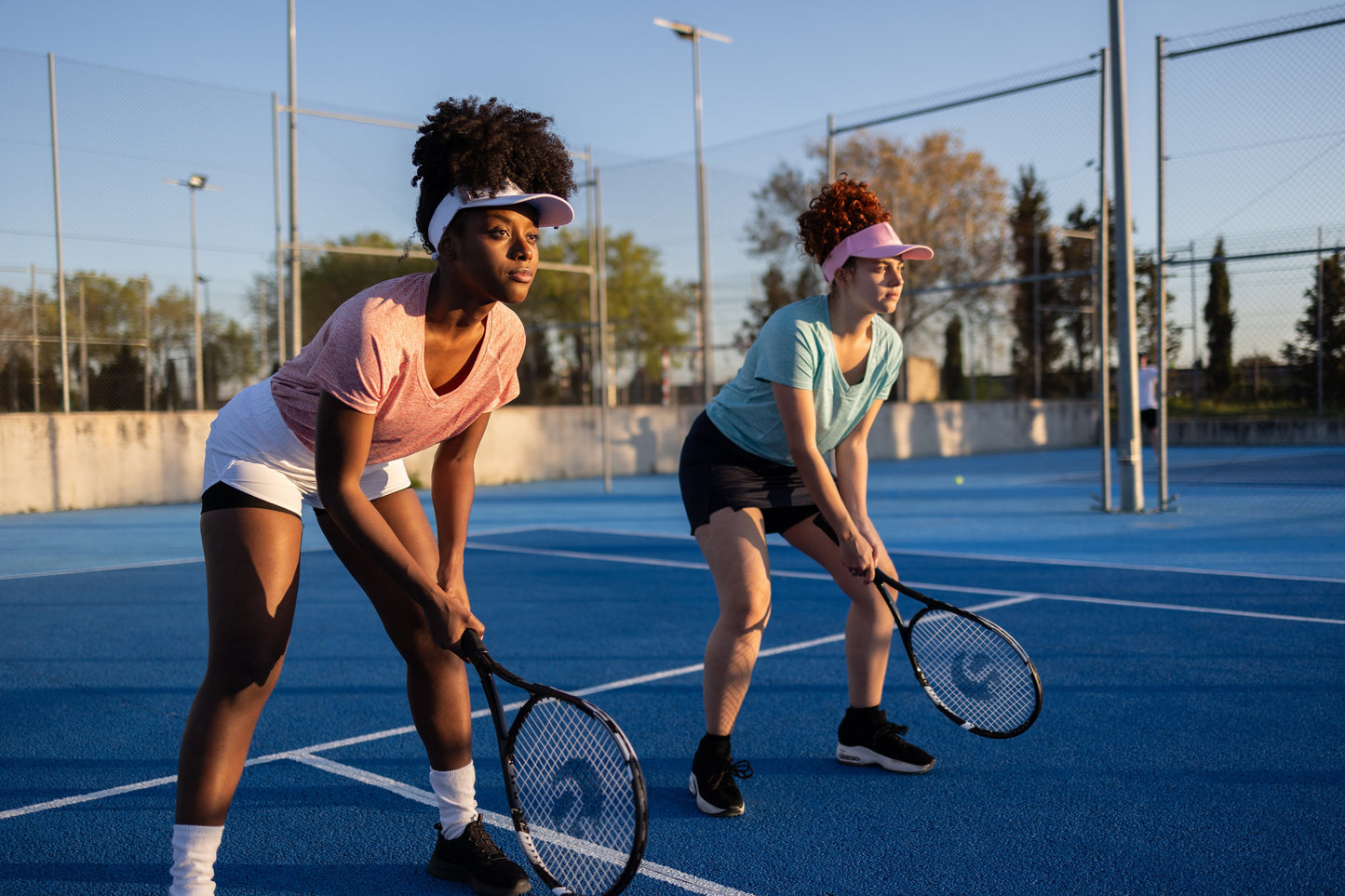 two people playing tennis